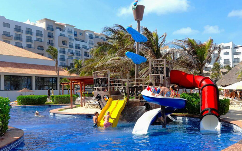 Children enjoying a kids’ pool at a hotel in Cancun