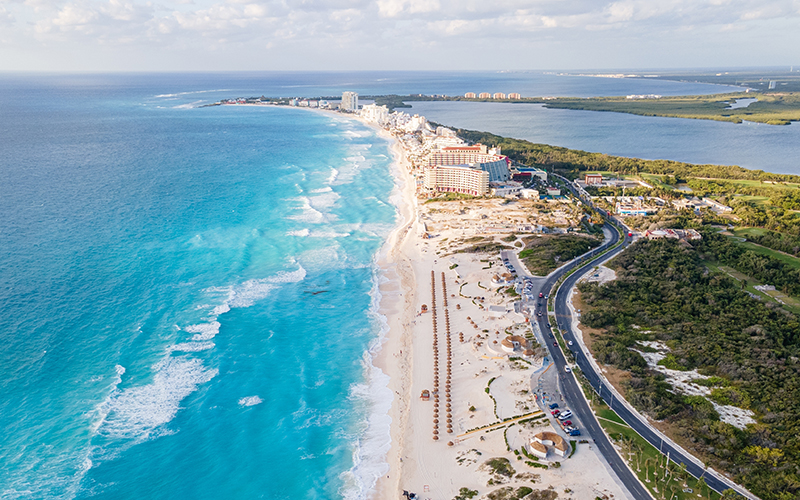 Playa Delfines in Cancun with white sand, turquoise waters, and views of the Caribbean Sea.